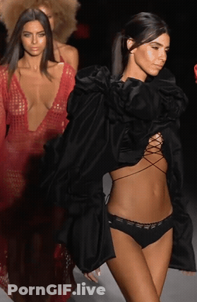 Priscilla Huggins Smiles On The Catwalk In Fishnet Lingerie GIF