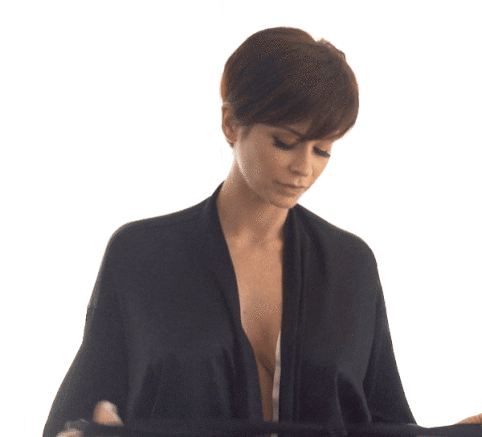 Undressing With Big Tits And Short Hair GIF