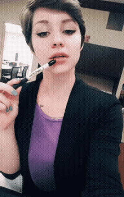 Brunette Cutie With Short Hair Sticking Out Her Tongue GIF