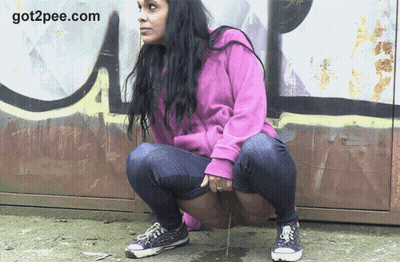 European Pissing In Public: A Sneaky Peek At A Woman Peeing In The Street GIF