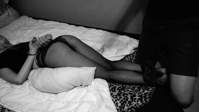 Fishnet Struggle: Belt Cuffed Sexy GIF