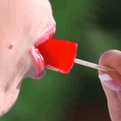 Licking A Lollipop: A Sweet, Erotic Experience GIF
