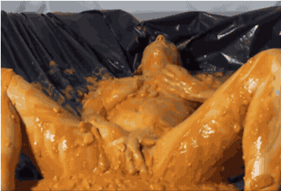 Sexy Slut In A Bucket Of Yellow Jelly GIF