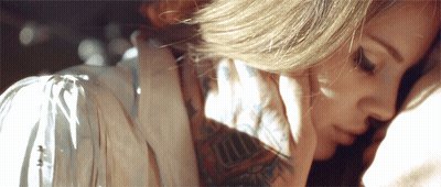 Tattooed Hottie's Sultry Seduction GIF