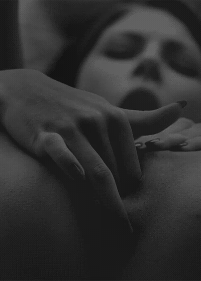 The Girl Puts Two Fingers In Her Pussy GIF